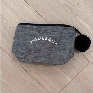 Gray HOME BODY Pouch with Black Pom Pom